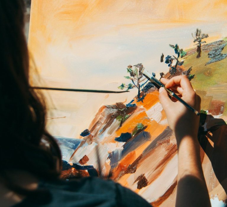 Royalties and IP income experts Artist painting canvas representing creative professionals receiving royalties who use Hayes & Co specialist IP accounting in East London